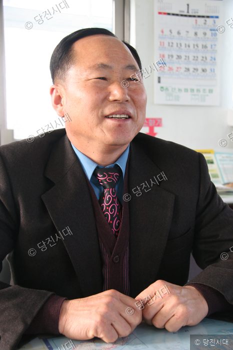 조봉현 당진군농촌지도자연합회 회장이 환하게 웃고 있다.